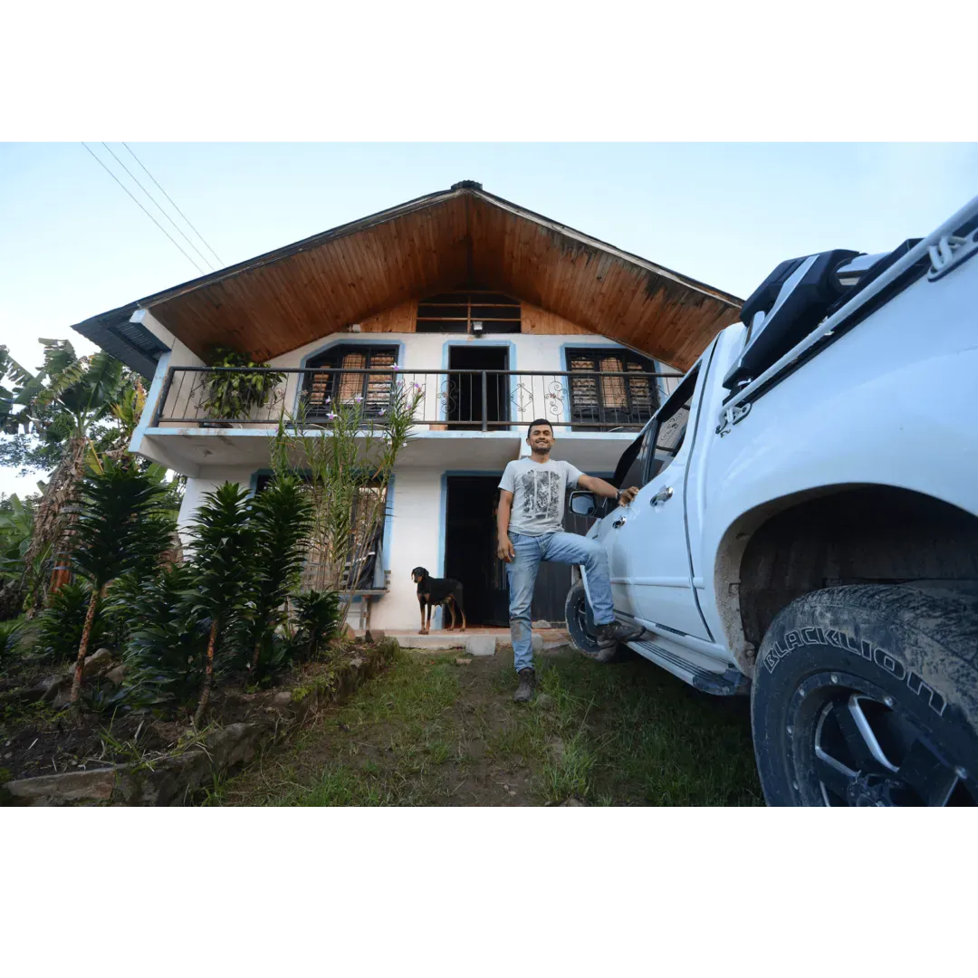 Oscar in front of his house